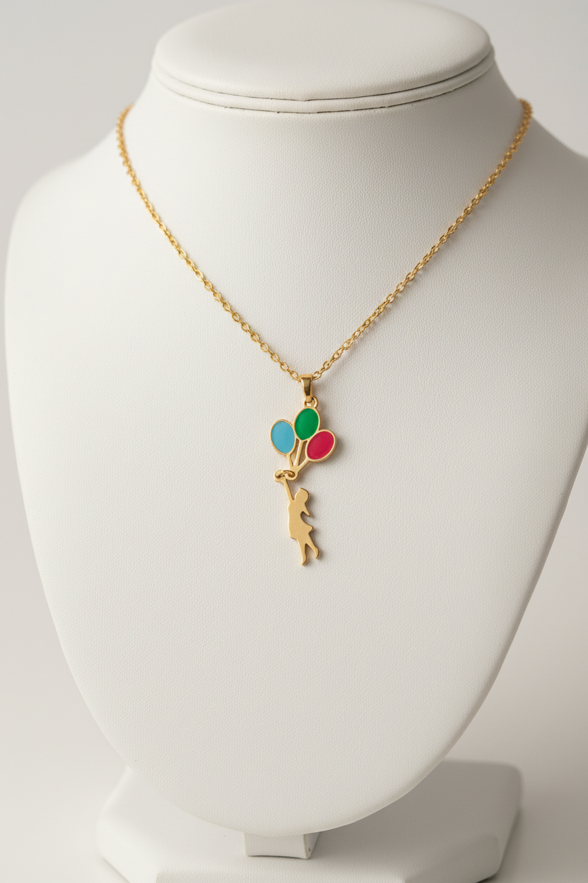 Gold necklace tiny pendant on display